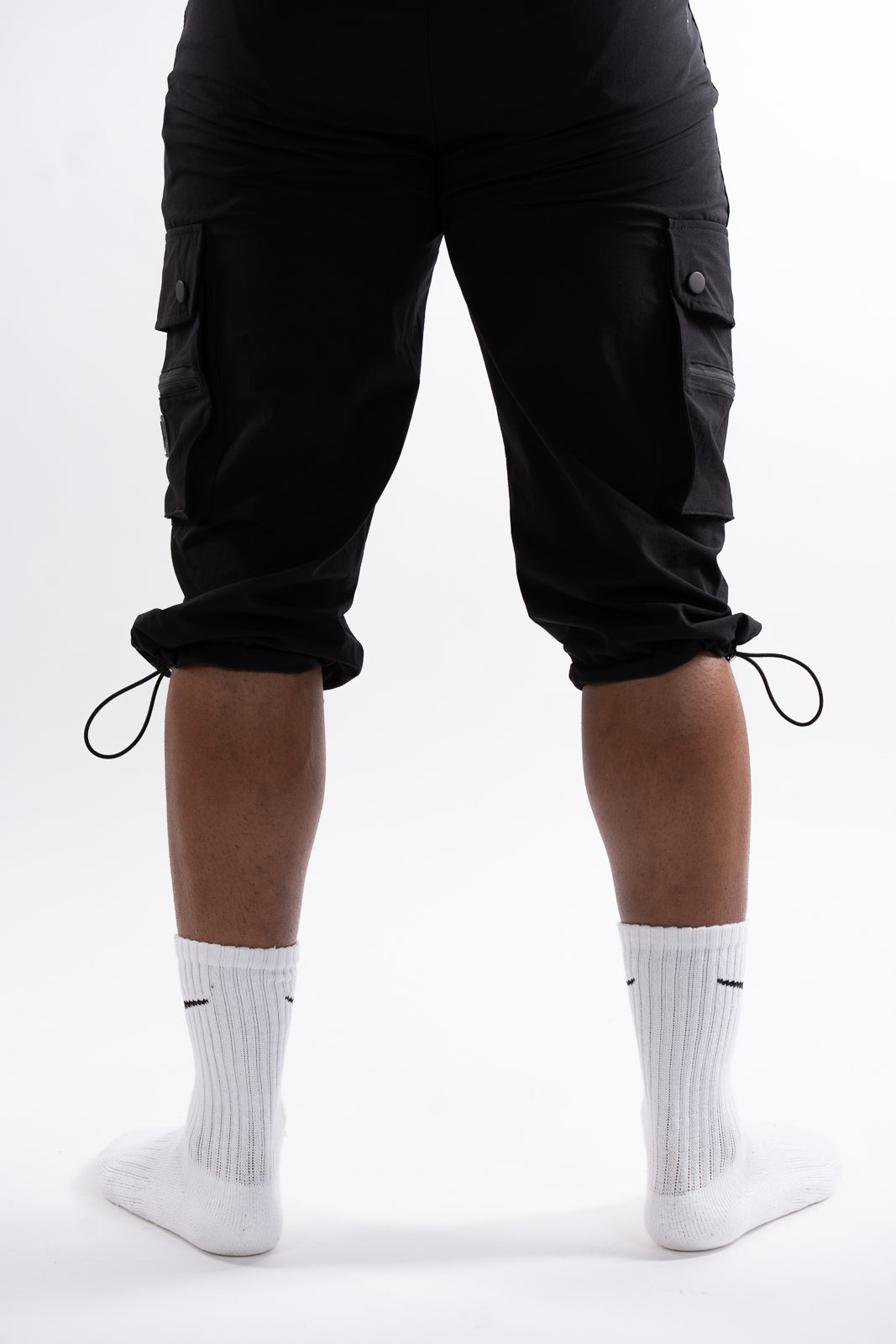 Back view of men’s awrah-covering 3 quarter shorts with bungee cord detail