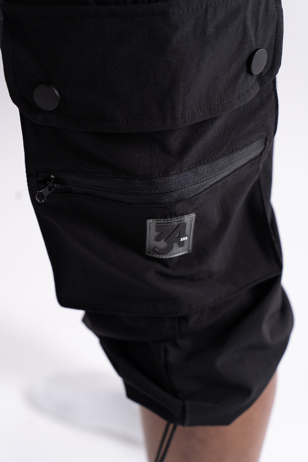 Close-up of pocket flap with snap closure on men’s 34ERS® prayer-friendly cargo shorts
