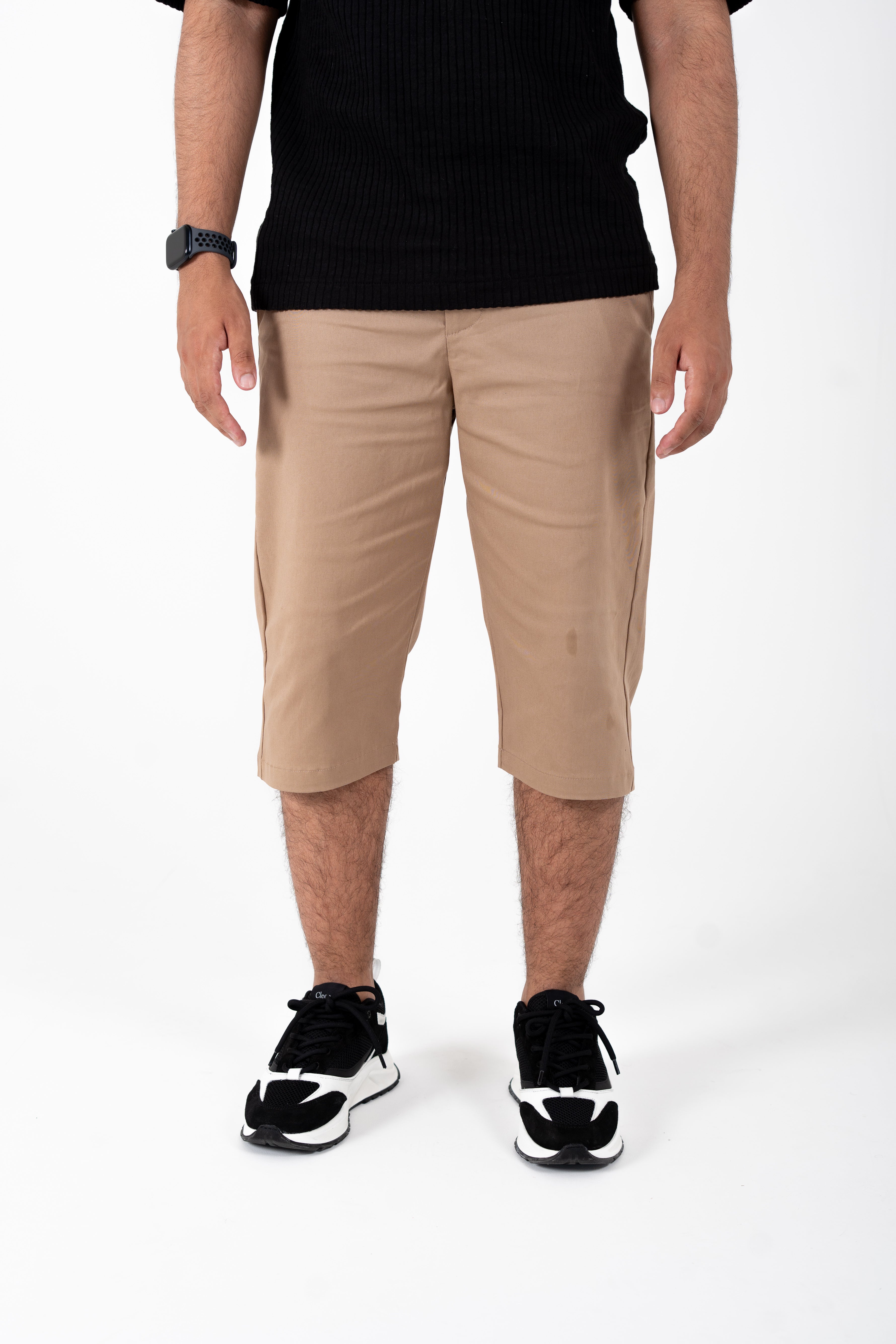Front view of men’s knee-length sand chino shorts with tailored slim fit

