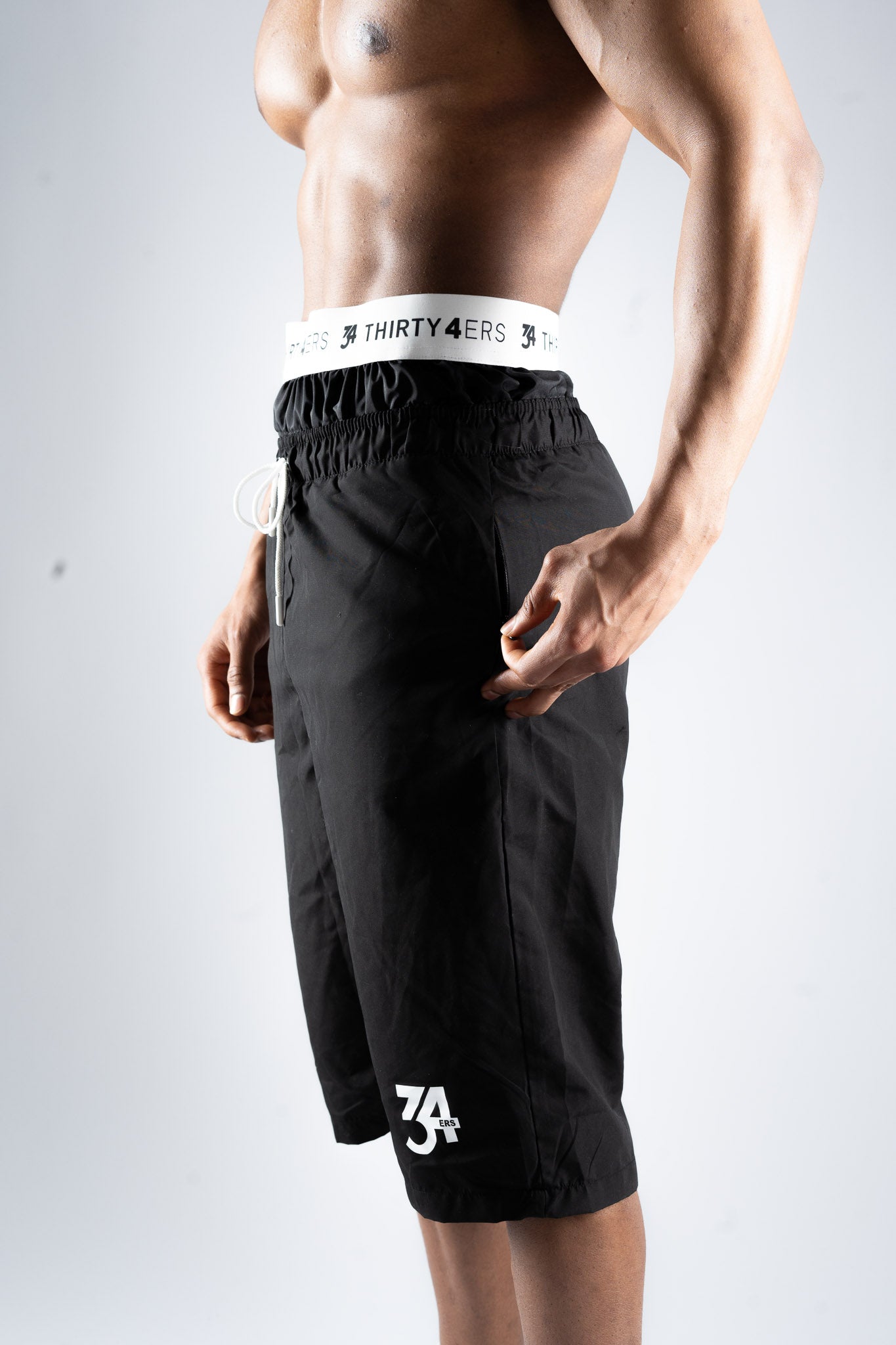 Back view of black 34ERS® swim shorts showing soft stretch fit and coverage


