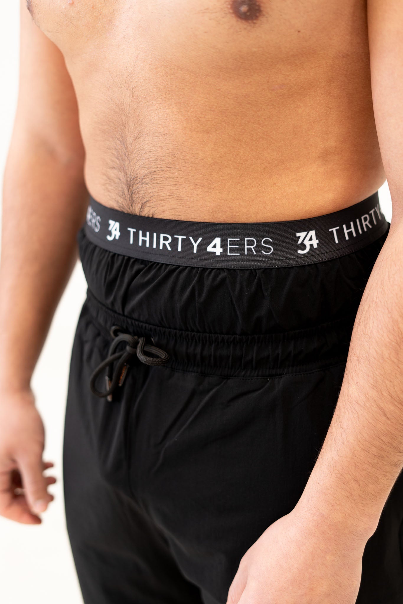 Detailed waistband shot with drawstring and soft-touch polyester fabric

